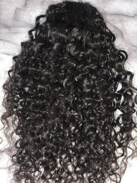 This is our peace (Indian curly- deep curly) ponytail in it's natural state and color. 