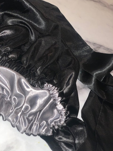 Satin Lined Bonnet Slip Proof Keeps Edges Laid! Black on the outside and grey on the inside. Includes satin scarf to lay down edges. Cost is $30. 